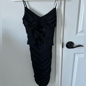 Black mini party dress with mid slits.